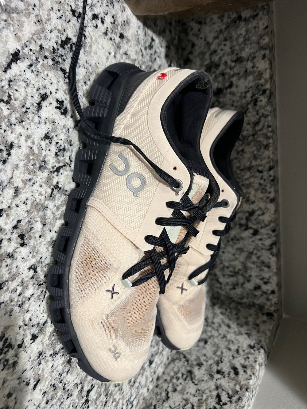 On Running Beige and Black Men’s Athletic Shoes
